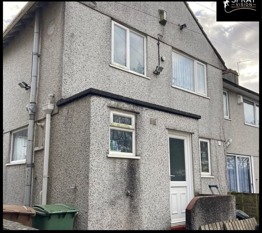 House exterior — before masonry respray, Devon